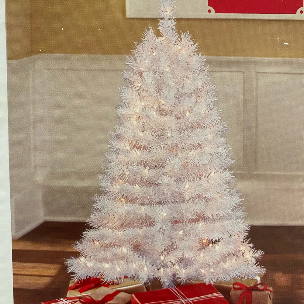 4ft pre lit Christmas tree,  plus a few ornaments come with it.